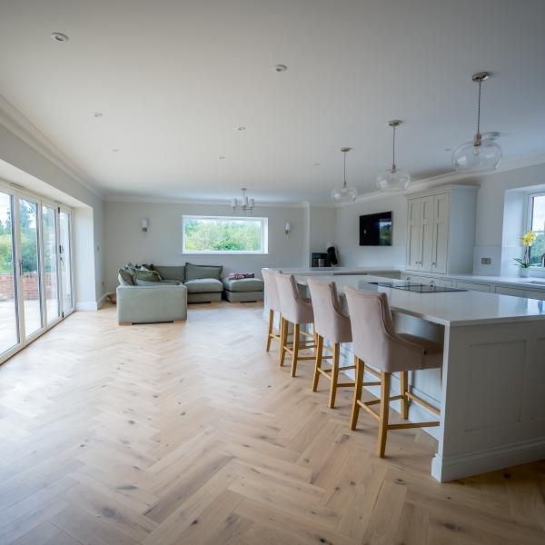 Large kitchen with island, bi-fold doors and Resurgence windows