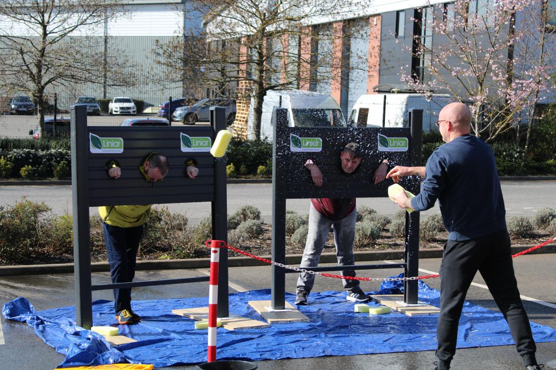 Liniar staff in stocks for Red Nose Day 