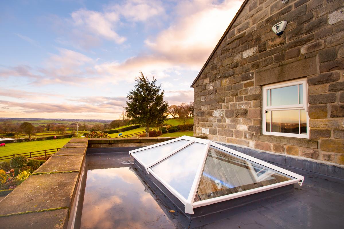 External view of white Elevate lantern roof on an extension 