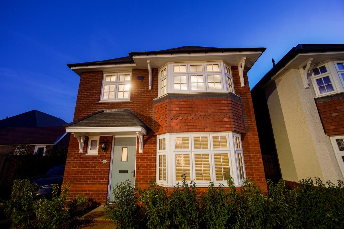 Four-bedroom, detached, redbrick home featuring Liniar 70mm casement and bay windows