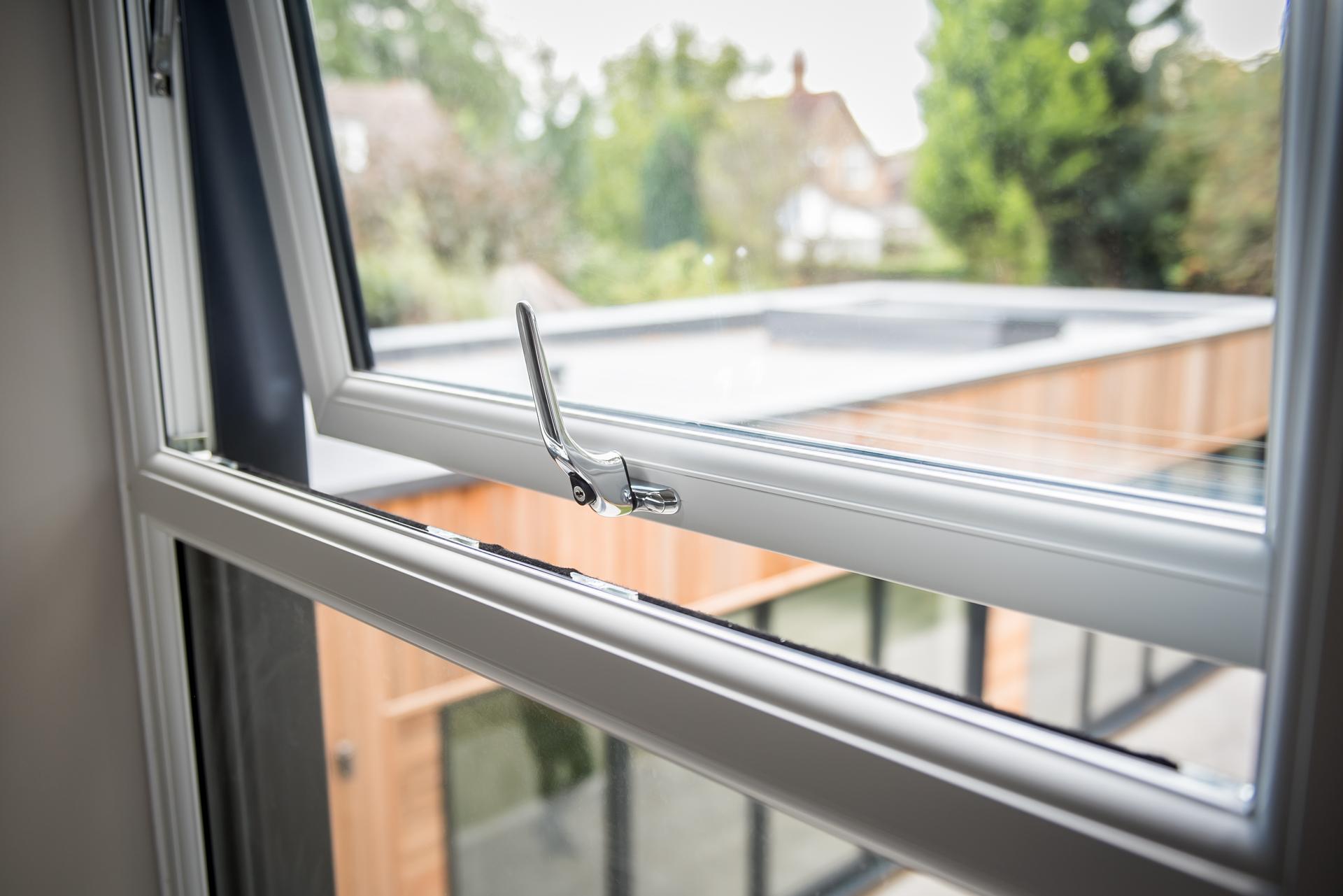 close up of open white casement Liniar window 