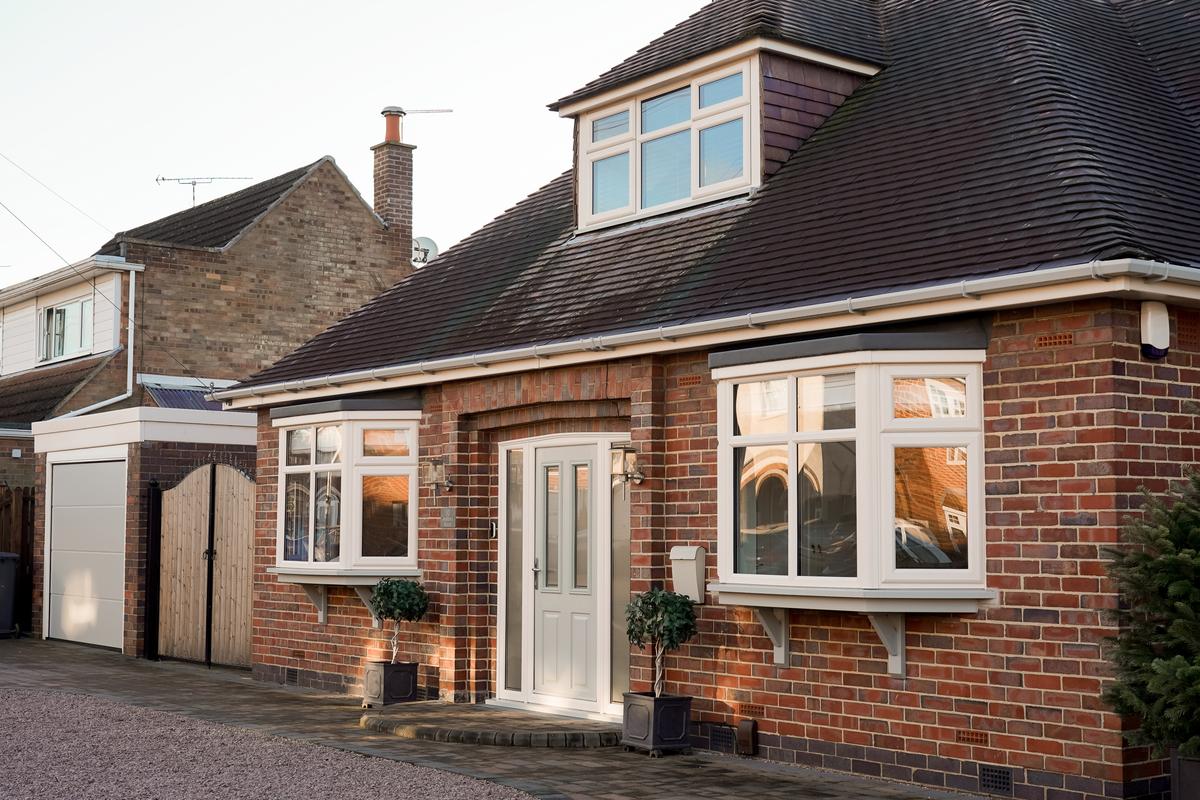 White Liniar bay windows on a dormer bungalow